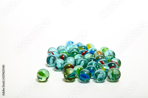 Фотография Group of glass marbles isolated on a white background