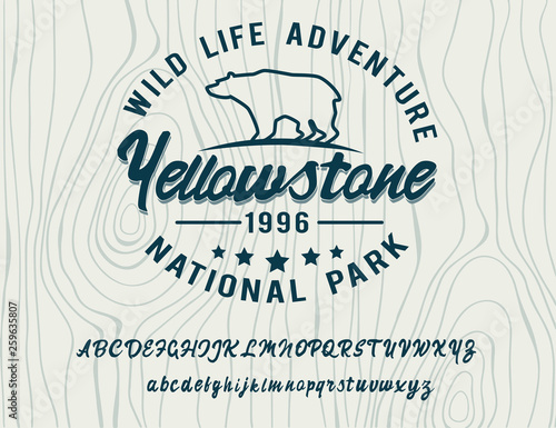 Wild life adventure. Yellowstone national park. Retro style. Handmade script font. Hipster style. Camping logo. Retro and vintage hadmade logo. Print on clothes, sticker.