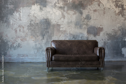 brown sofa on the wall background, loft style