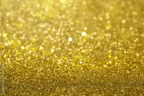 Abstract composition. Gold glitter light background with beautiful bokeh