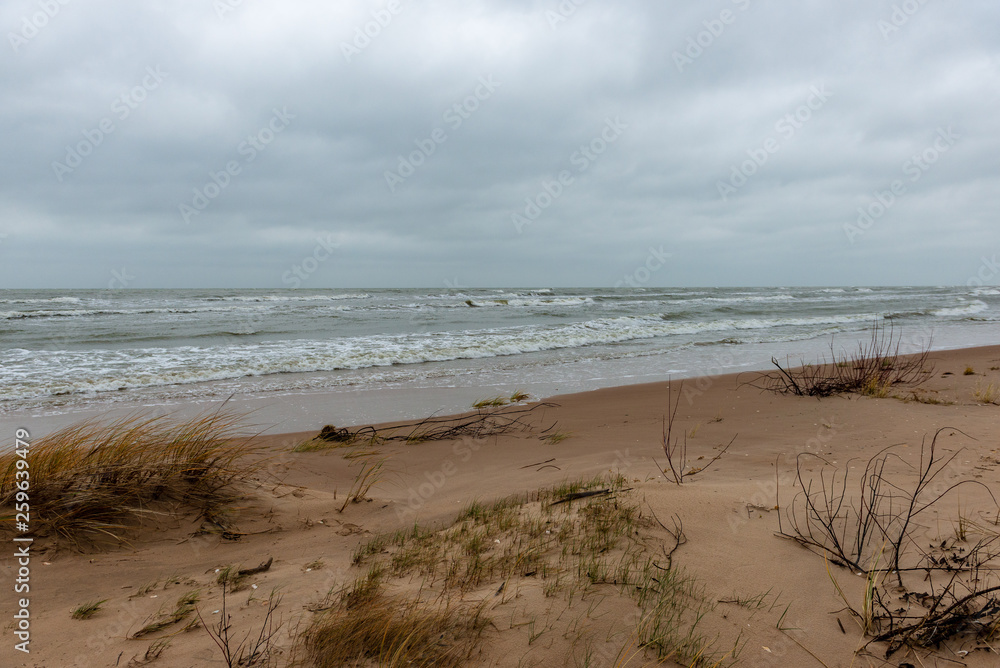 storm weather on the beach by rocky sea shore storm weather on the beach by rocky sea shore
