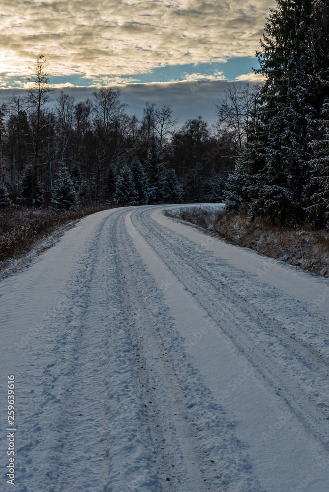 snowy winter road covered in ice and snow snowy winter road covered in ice and snow