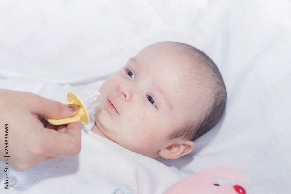 Cute newborn baby boy with easter pink easter bunny Cute newborn baby boy with easter pink easter bunny