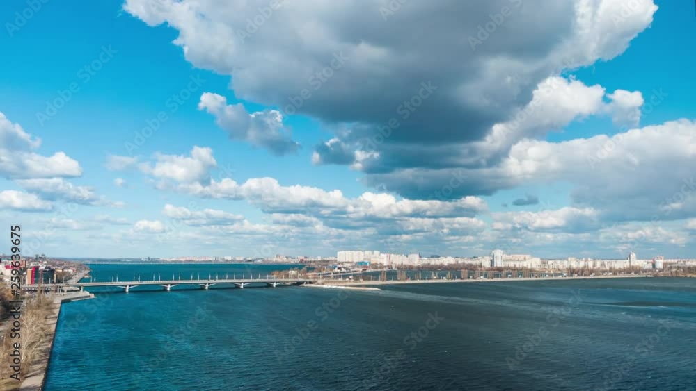 Time lapse 4k aerial view over the city cumulus clouds float across the sky on a windy sunny day Time lapse 4k aerial view over the city cumulus clouds float across the sky on a windy sunny day