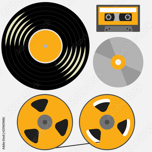 Different music records: vinyl, audio cassette, compact disk, reel to reel tape