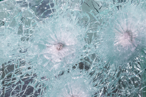 Bulletproof glass samples test. Glass passed the test after shots at him with a firearm. photo