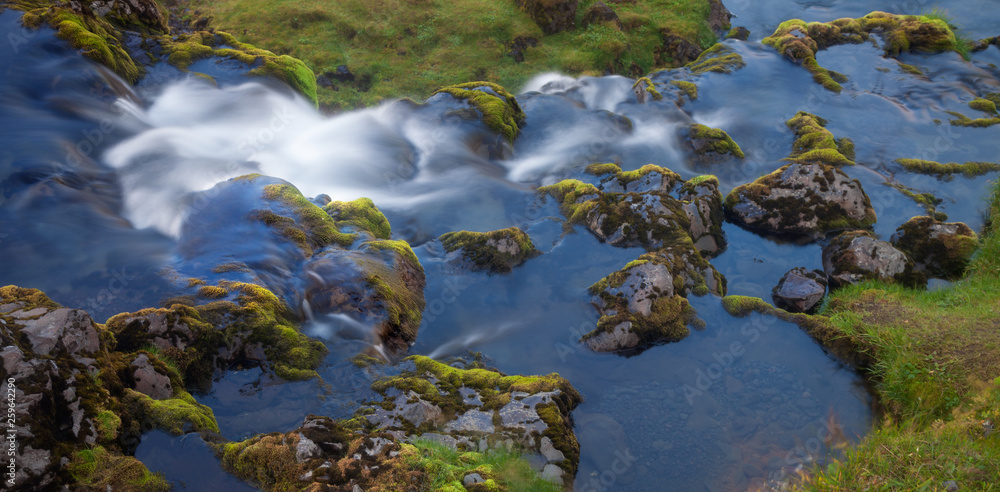 Stones and water. Waterfall in Western Iceland