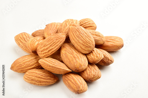 Closeup of almonds, isolated on the white background.