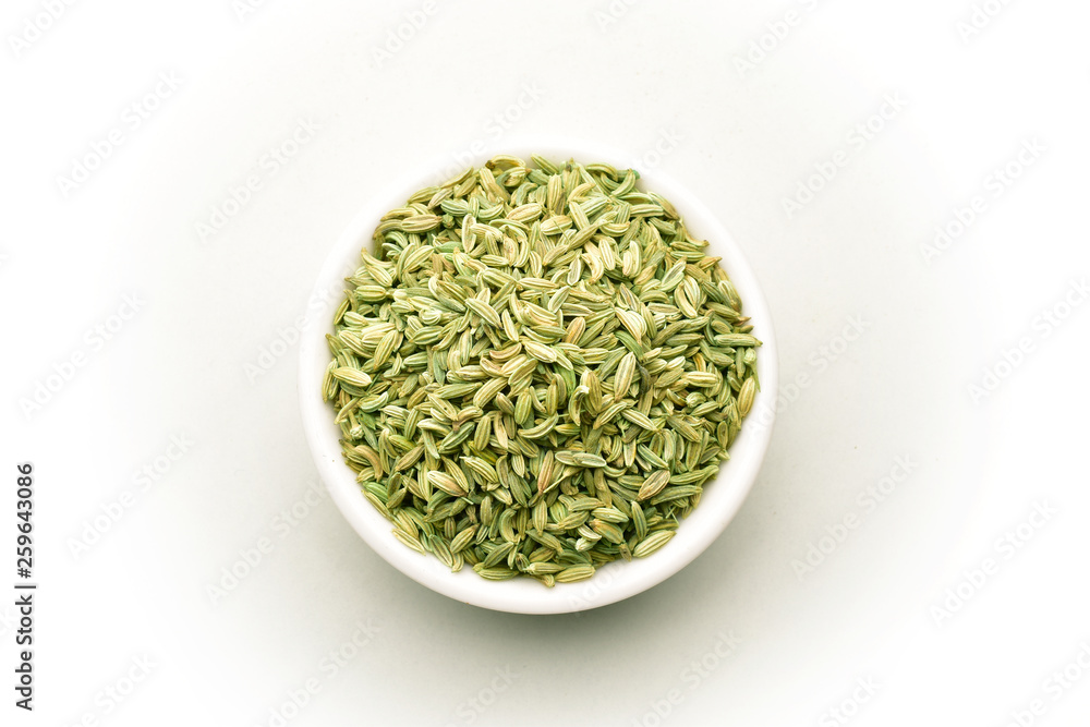 Saunf, Fennel seeds in the white ceramic bowl, isolated on white, top view