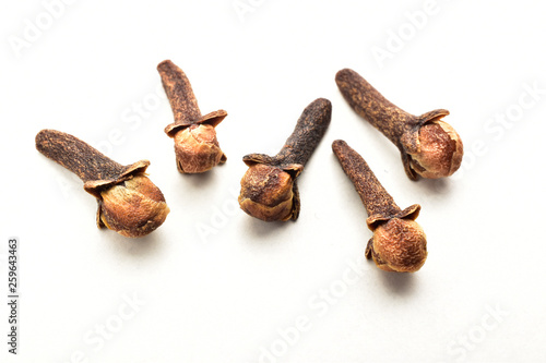 dry herb, dry cloves isolated on white background