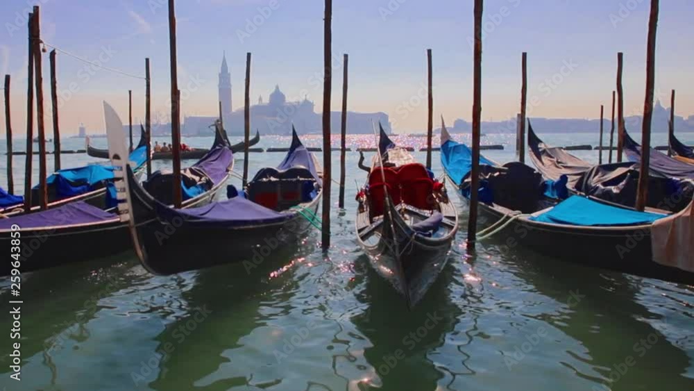 Romantic gondola tour, rowed by a gondolier in the Venice canal Romantic gondola tour, rowed by a gondolier in the Venice canal