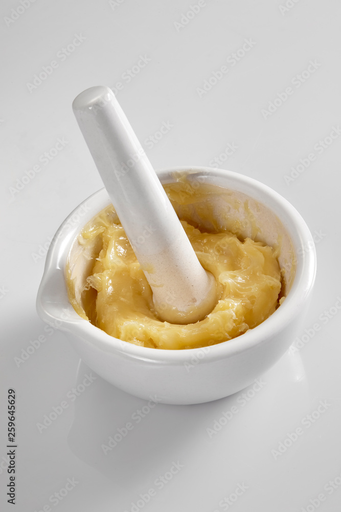 Close up of mixing medicine in the mortar and pestle Close up of mixing medicine in the mortar and pestle