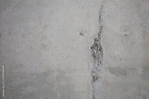 Formwork traces on concrete. Repair and construction or constructing. Concrete background. Grey color. Cement texture. Poor quality curve wall. Flaws  defects and cracks in the wall. .