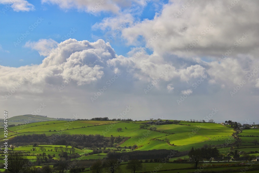 Scenic view of Irish hills and white clouds 