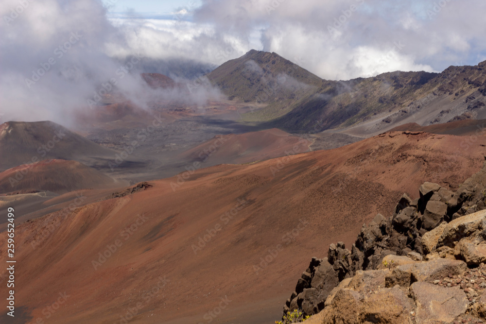Fototapeta premium View into Haleakala crater with clouds rolling in
