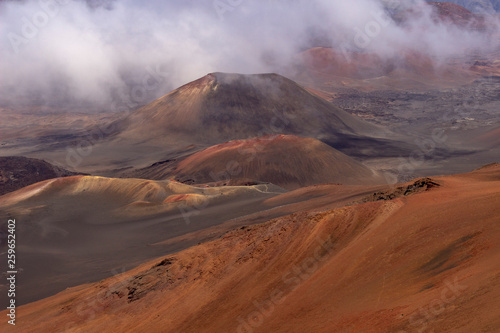 View into Haleakala Volcano National park as clouds slowly fill background