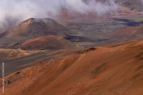 View into Haleakala Volcano National park as clouds slowly fill background
