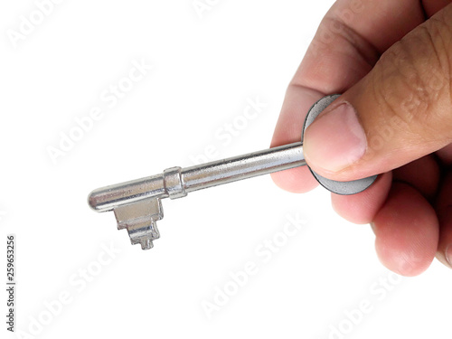 Hand holding the key Isolated on white background © Retouch man