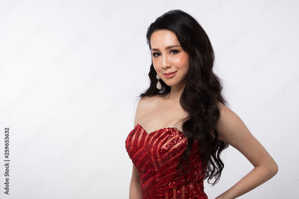 Evening Red sequin Gown Ball Dress in Asian beautiful woman with fashion make up face heart black hair, studio lighting white background isolated copy space. Concept touch diamond earrings gently Evening Red sequin Gown Ball Dress in Asian beautiful woman with fashion make up face heart black hair, studio lighting white background isolated copy space. Concept touch diamond earrings gently