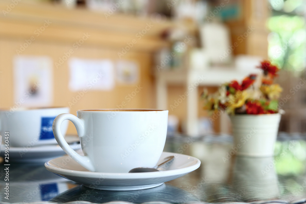 white cup of hot coffee drink put on table in cafe restaurant white cup of hot coffee drink put on table in cafe restaurant