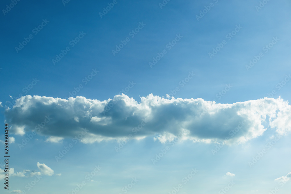 Fototapeta premium fluffy cloud above clear blue sky