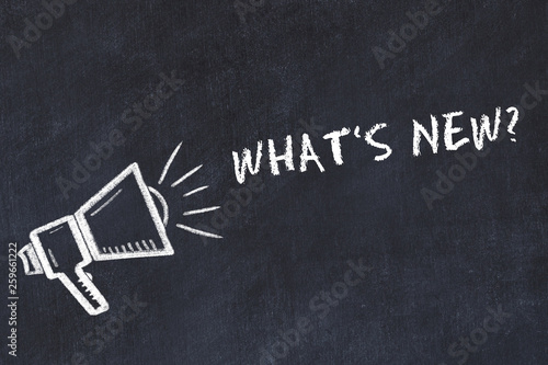 Chalk board sketch with loudspeaker and phrase whats new