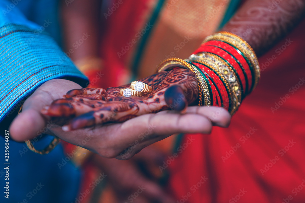 Golden engagement ring in hand Golden engagement ring in hand