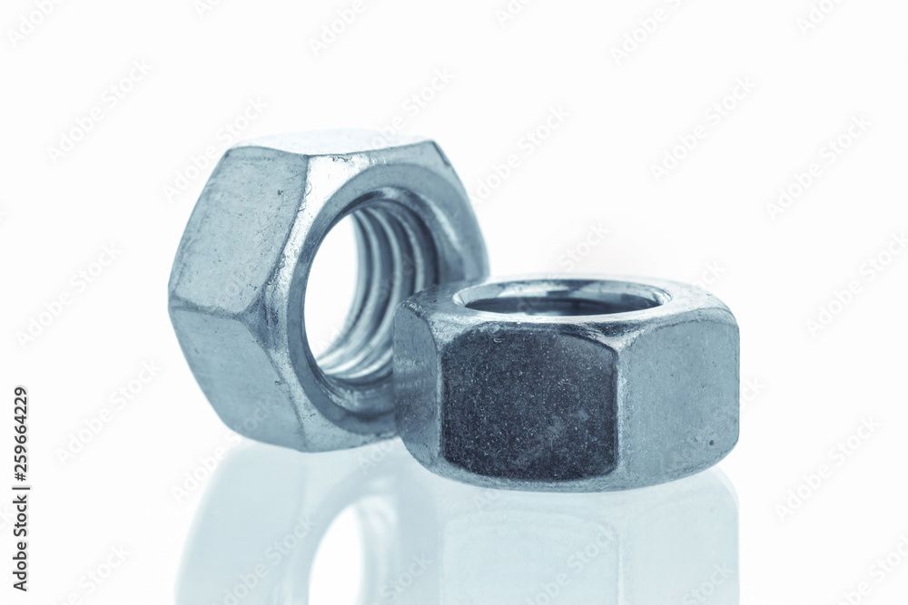Closeup Bolts, steel screwbolts and nuts Used for capturing workpieces mechanical parts And construction isolated on a white background industrial concept Closeup Bolts, steel screwbolts and nuts Used for capturing workpieces mechanical parts And construction isolated on a white background industrial concept