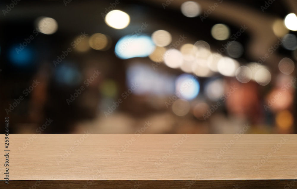 Empty dark wooden table in front of abstract blurred bokeh background of restaurant . can be used for display or montage your products.Mock up for space. Empty dark wooden table in front of abstract blurred bokeh background of restaurant . can be used for display or montage your products.Mock up for space.