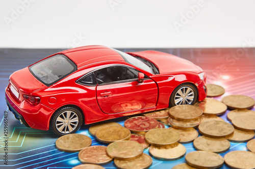 Model cars and currency in the background