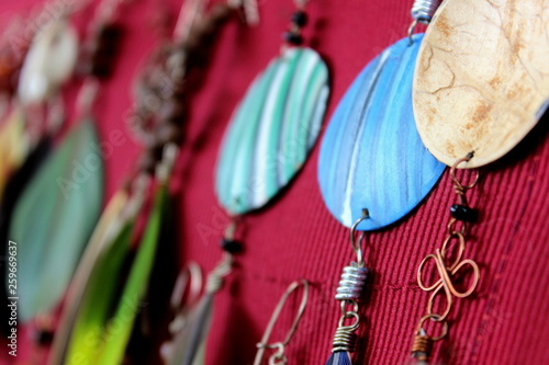 Quadro em tela Detail of handmade earrings on display at hippie handicraft fair.