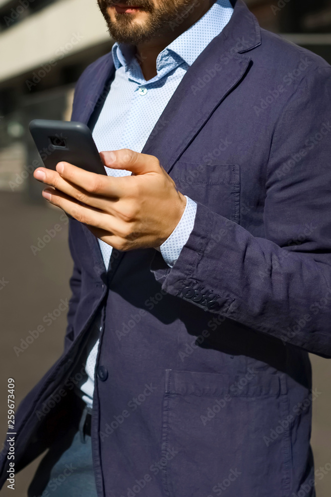 Handsome bearded man on street use smartphone Handsome bearded man on street use smartphone