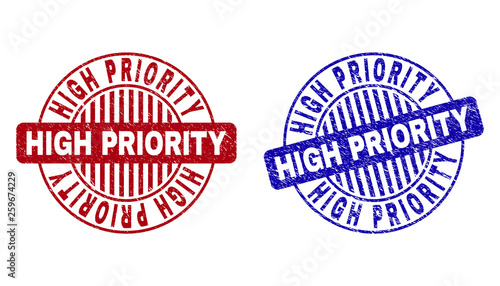 Grunge HIGH PRIORITY round stamp seals isolated on a white background. Round seals with grunge texture in red and blue colors.