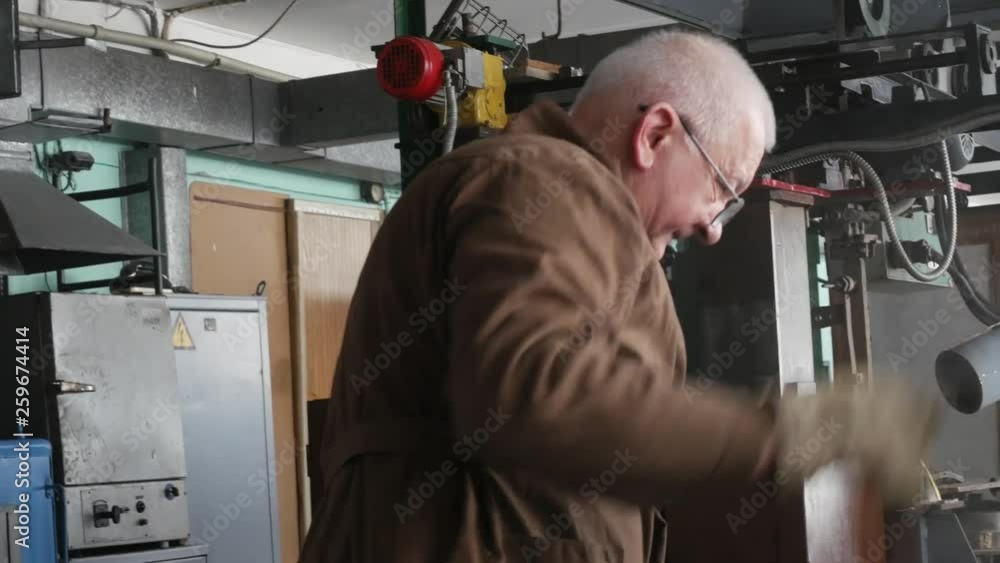 Bandsaw in the workshop. Band saw cutting metal. Engineer cutting of metal billet. Bandsaw in the workshop. Band saw cutting metal. Engineer cutting of metal billet.