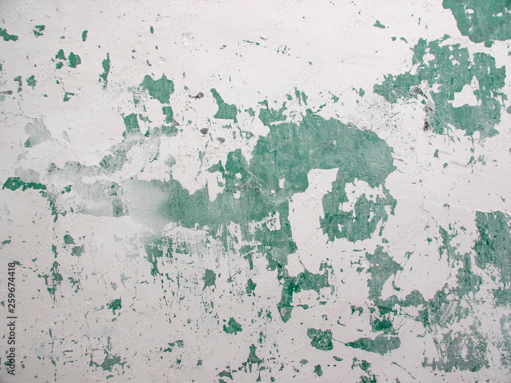 Old paint on a stone wall. Texture of old paint on the wall. Old paint on a stone wall. Texture of old paint on the wall.