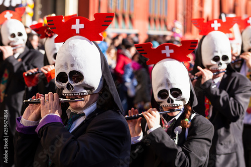 Basel carnival 2019 piccolo player with skull shaped mask photo