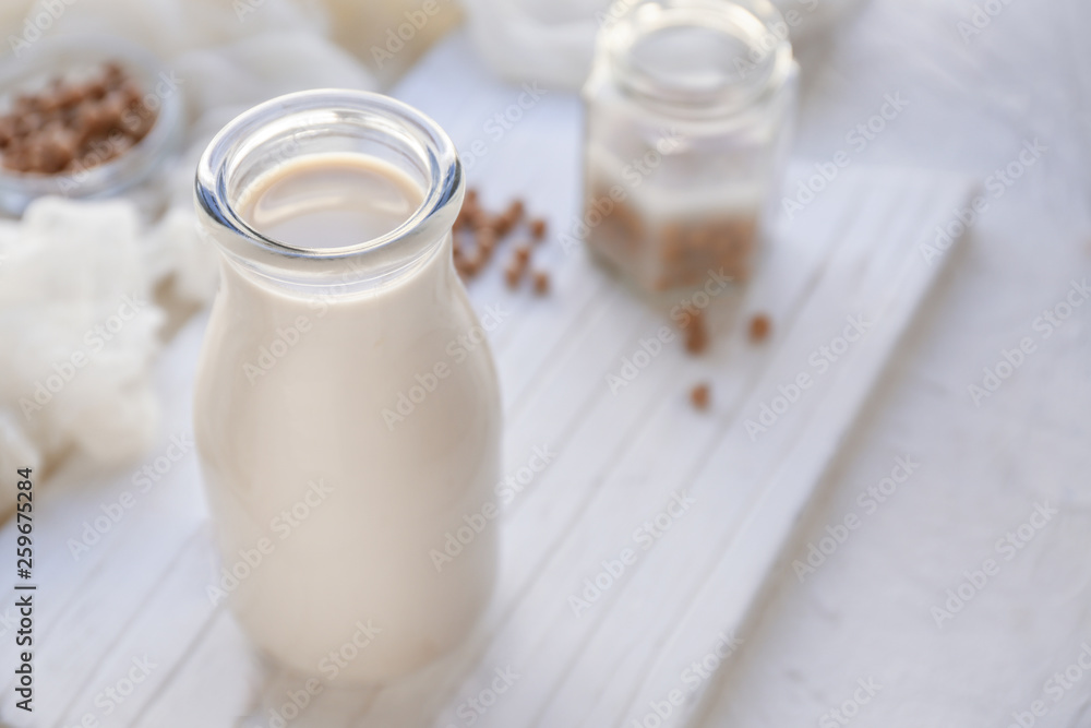 Bottle of healthy soy milk on table Bottle of healthy soy milk on table