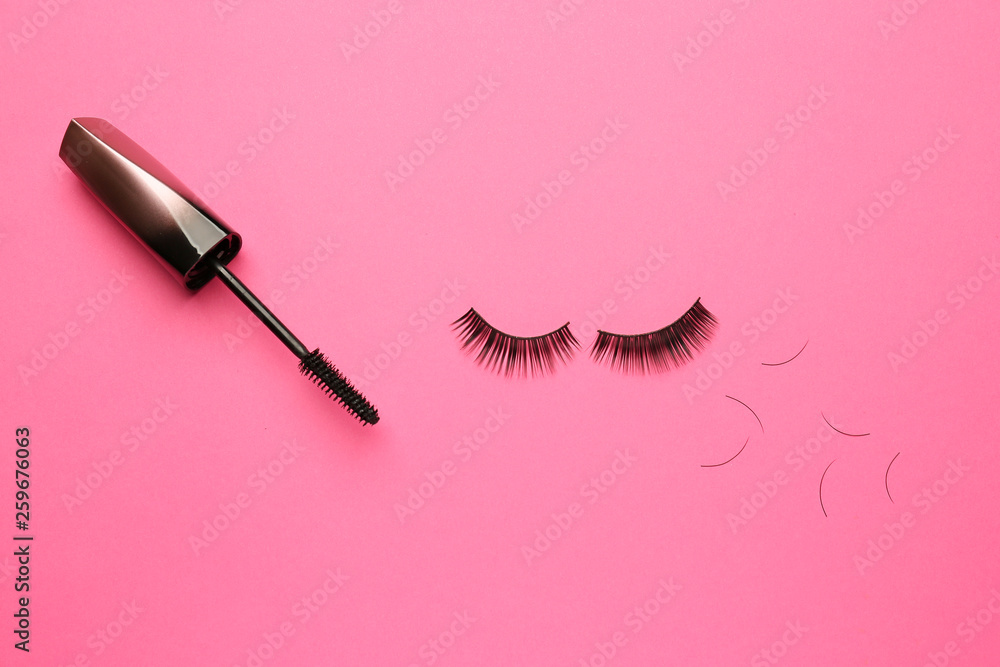 Obraz premium Mascara with false eyelashes on color background