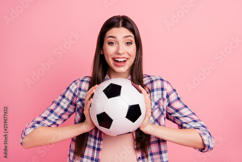 Portrait of her she nice-looking attractive cute charming lovely girlish cheerful straight-haired lady wearing checked shirt holding in hands black white ball isolated over pink background © deagreez