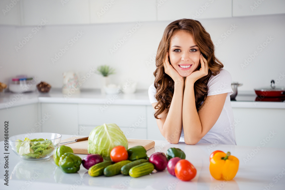 Portrait of her she nice-looking attractive sweet charming lovely cheerful wavy-haired girl making house work fresh lunch dinner farm organic vegs in light white interior room