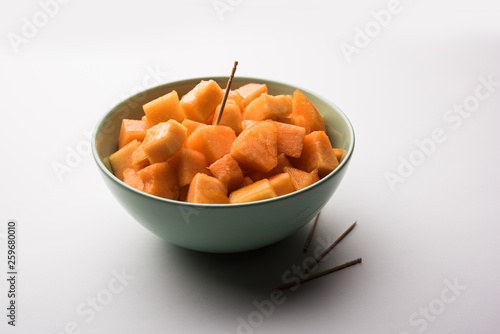 Cantaloupe / muskmelon / kharbuja cut into pieces, served in a bowl. selective focus photo