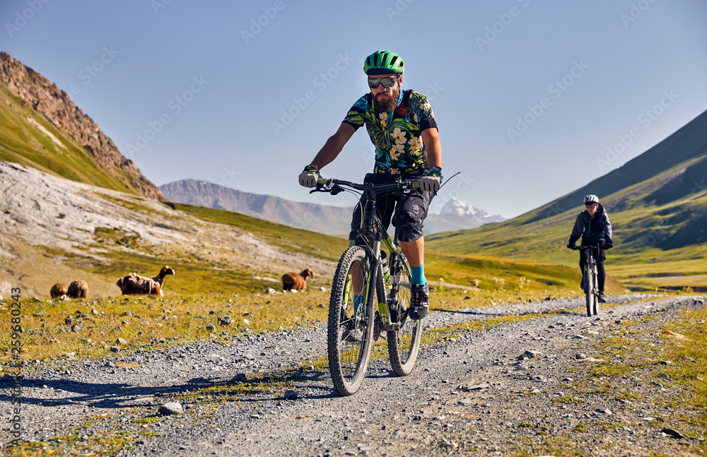 Man ride bicycle in the mountains