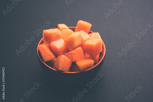 Cantaloupe / muskmelon / kharbuja cut into pieces, served in a bowl. selective focus photo