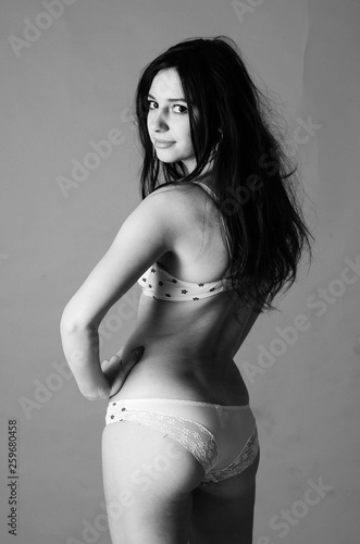Beautiful young slender girl (woman) with long hair, wearing a w