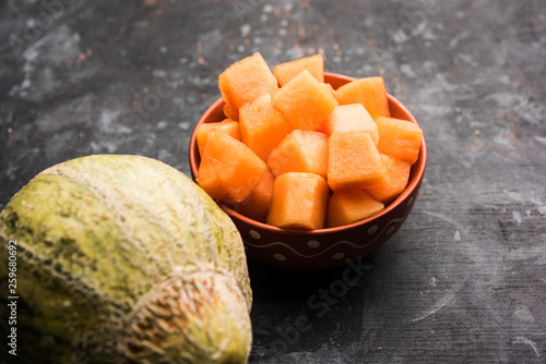 Cantaloupe / muskmelon / kharbuja cut into pieces, served in a bowl. selective focus photo