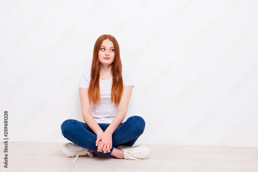 Full length body size photo beautiful she her lady tricky look empty space overjoyed  long straight hair sit floor legs crossed wear casual t-shirt jeans denim outfit clothes isolated white background