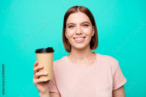 Close up photo beautiful amazing her she lady hold arm paper hot coffee take away made best way wakeup awaking favorite americano latte cappuccino wear casual t-shirt isolated teal turquoise © deagreez