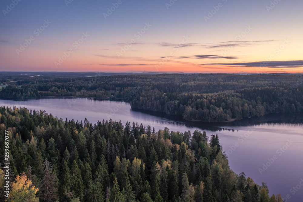 Scenic landscape with lake and sunset at evening in Aulanko, nature reserve, Finland