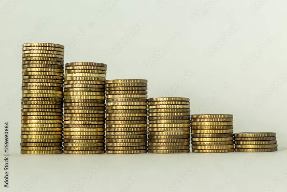 Stacks of copper coins on a white background. Ascending movement. A good image for a site about finance, money, collection, relationships. Stacks of copper coins on a white background. Ascending movement. A good image for a site about finance, money, collection, relationships.