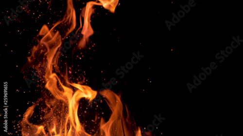 Fotografie MACRO: Beautiful bright orange flames flicker in the darkness of the night